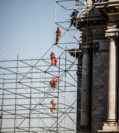 Concrete sidewalk repair, driveway installation, and roofing services for residential and commercial properties in NYC